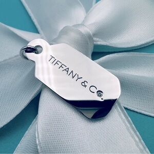 Tiffany & Co. Authentic, sterling silver Tiffany & Co. Diamond tag charm.
